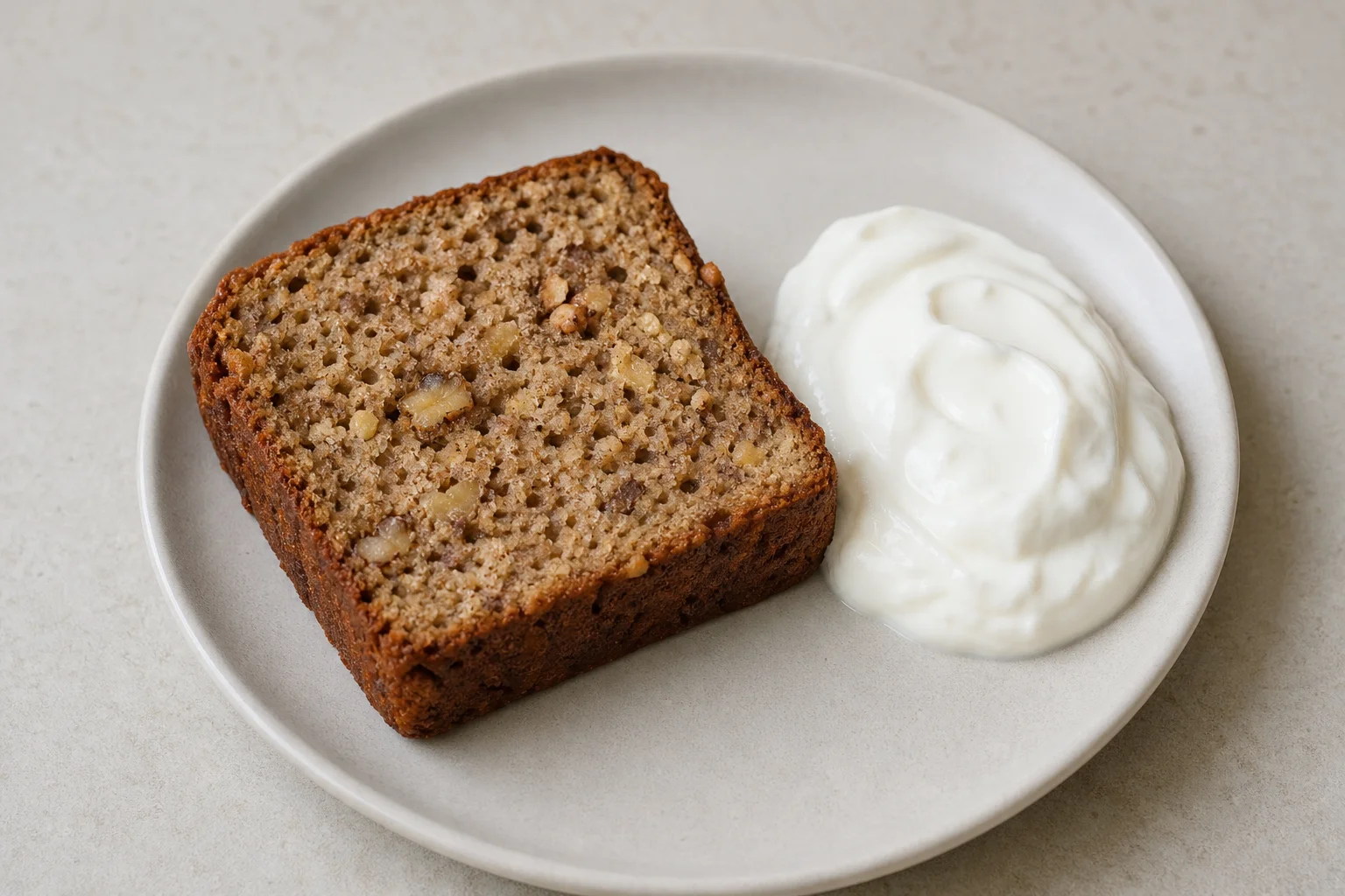 Banana bread slice with yogurt